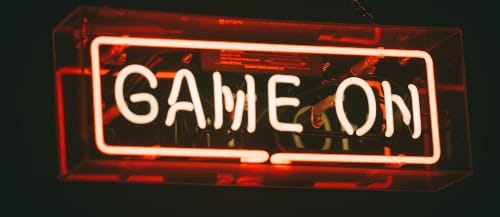 red and white Game On LED signage